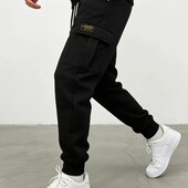 Стильні утеплені штани джогери з накладними кишенями